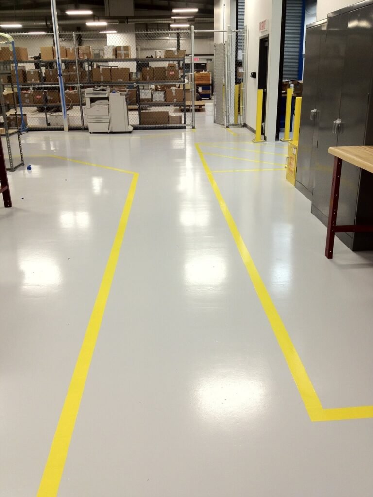 A warehouse with trusted epoxy flooring experts' yellow lines on the floor.