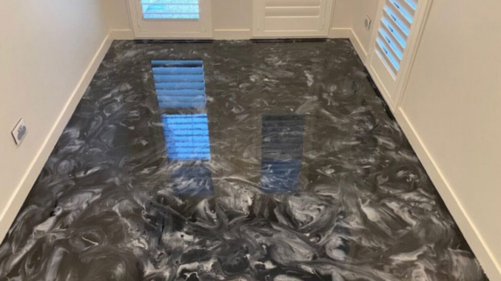 Gray metallic epoxy flooring installation in a residential home
