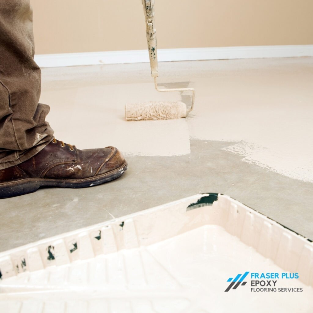 Painter Rolling Epoxy Paint on Concrete Epoxy Flooring Vancouver