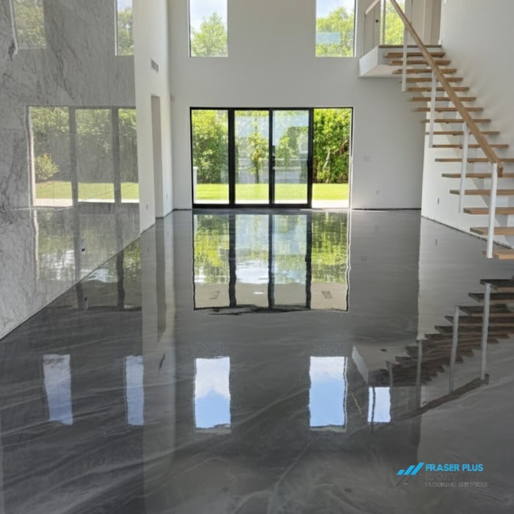 A sleek, metallic gray floor in a modern home showcases the durable results of professional Burnaby epoxy flooring maintenance.